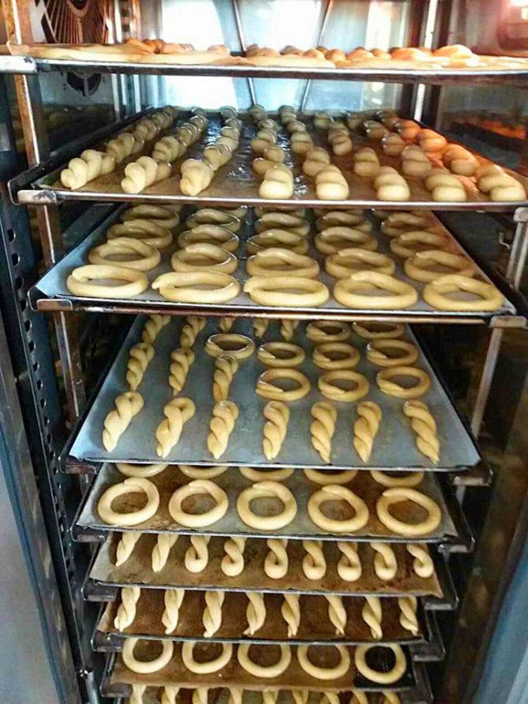 metal frames with kuluraki Greek Easter cookies on top of each other at The Apolloniatisses